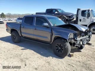 2021 Toyota Tacoma 4WD SR with VIN 5TFCZ5AN6MX252195, listed as a Copart auction lot 48234085 with 56,983 mi miles and Salvage Title. Bid and sale history available at carsss.com. Image 4.