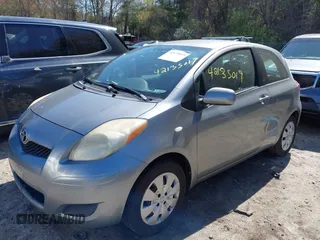 2009 Toyota Yaris with VIN JTDJT903495263456, listed as a IAAI auction lot 42135019 with 219,704 mi miles. Bid and sale history available at carsss.com. Image 2.