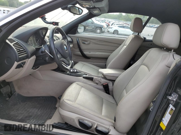2011 BMW 1 Series 128i with VIN WBAUN1C58BVH82487, listed as a Copart auction lot 54295625 with 60,879 mi miles and Salvage title. Bid and sale history available at DreamBid. Image 7.