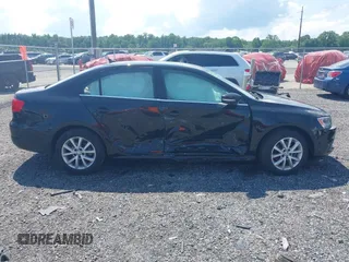 2014 Volkswagen Jetta SE with VIN 3VWD17AJ4EM429576, listed as a IAAI auction lot 42542604 with 142,313 mi miles and . Bid and sale history available at DreamBid. Image 13.