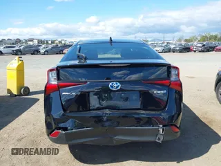 2021 Toyota Prius L Eco with VIN JTDKAMFU6M3135799, listed as a IAAI auction lot 42064241 with 77,120 mi miles and . Bid and sale history available at DreamBid. Image 6.