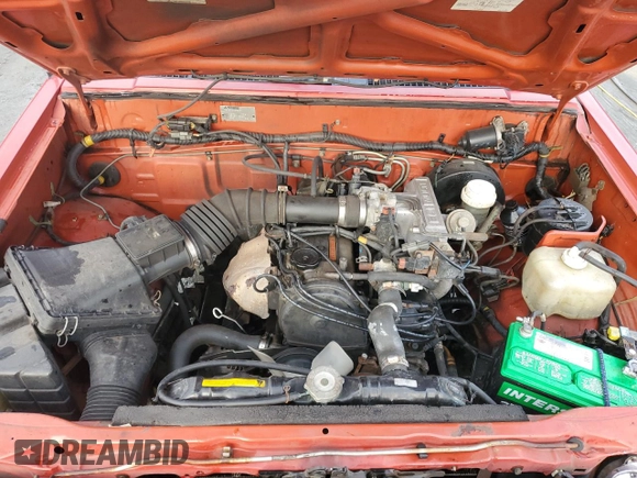 1991 Mitsubishi Mighty Max z VIN JA7FL24W3MP017705, wystawiony jako Copart lot #85737304 z przebiegiem 261 896 mil mil oraz Szkody całkowita. Historia ofert i sprzedaży dostępna na DreamBid. Obrazek 11.