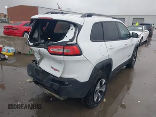 2015 Jeep Cherokee Trailhawk with VIN 1C4PJMBB1FW630519, listed as a IAAI auction lot 41605466 with 219,390 mi miles and . Bid and sale history available at carsss.com. Image 4.