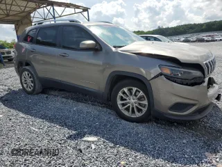 2020 Jeep Cherokee Latitude with VIN 1C4PJLCBXLD556789, listed as a Copart auction lot 58582565 with 66,865 mi miles and Salvage title. Bid and sale history available at DreamBid. Image 4.