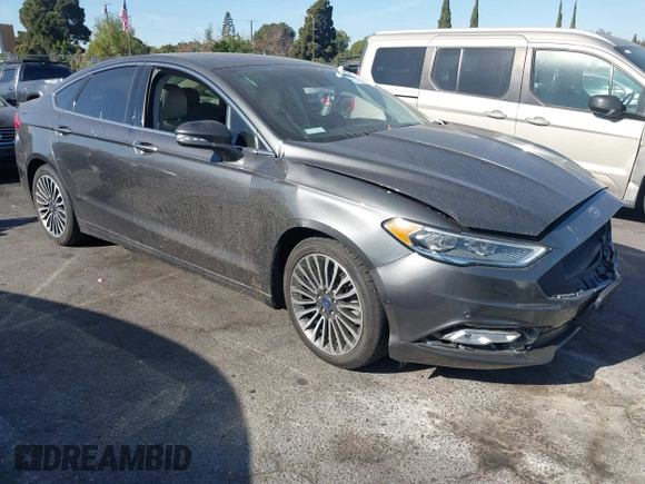 2017 Ford Fusion Titanium z VIN 3FA6P0SU5HR105477, wystawiony jako IAAI lot #41072696 z przebiegiem 92 926 mil mil oraz . Historia ofert i sprzedaży dostępna na DreamBid. Obrazek 1.