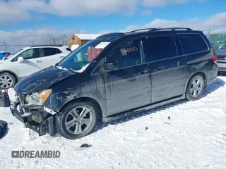 2008 Honda Odyssey Touring with VIN 5FNRL38948B029193, listed as a IAAI auction lot 41618424 with 219,964 mi miles. Bid and sale history available at carsss.com. Image 20.
