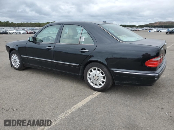 2001 Mercedes-Benz E-Class AWD with VIN WDBJF82J91X060969, listed as a Copart auction lot 71986544 with 113,694 mi miles and Salvage Title. Bid and sale history available at carsss.com. Image 2.