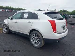2013 Cadillac SRX Performance Collection with VIN 3GYFNHE34DS628486, listed as a IAAI auction lot 42530124 with 76,778 mi miles and . Bid and sale history available at DreamBid. Image 3.