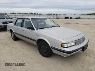 1992 Oldsmobile Cutlass z VIN 1G3AL54N7N6363365, wystawiony jako Copart lot #76144254 z przebiegiem 52 896 mil mil oraz Tytuł czysty. Historia ofert i sprzedaży dostępna na DreamBid. Obrazek 4.