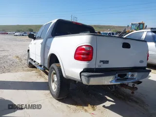 2003 Ford F-150 XLT with VIN 1FTRW08L63KA28964, listed as a IAAI auction lot 41689700 with 303,789 mi miles. Bid and sale history available at carsss.com. Image 3.