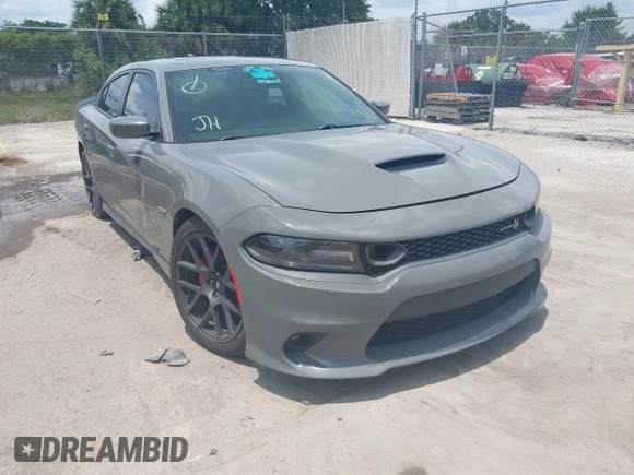 2019 Dodge Charger Scat Pack with VIN 2C3CDXGJ2KH633854, listed as a IAAI auction lot 42212517 with 74,285 mi miles and . Bid and sale history available at DreamBid. Image 1.