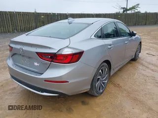 2019 Honda Insight Touring z VIN 19XZE4F93KE020162, wystawiony jako IAAI lot #42366605 z przebiegiem 120 256 mil mil oraz . Historia ofert i sprzedaży dostępna na DreamBid. Obrazek 4.