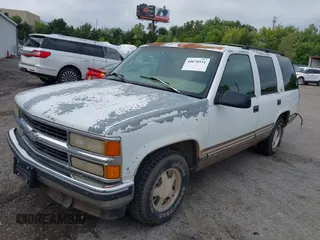 1997 GMC Yukon with VIN 1GKEC13R8VJ761054, listed as a IAAI auction lot 40070531 with 237,043 mi miles. Bid and sale history available at carsss.com. Image 2.