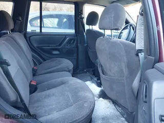 2001 Jeep Grand Cherokee Laredo with VIN 1J4GW48S11C578001, listed as a IAAI auction lot 41671318 with 263,694 mi miles. Bid and sale history available at carsss.com. Image 8.