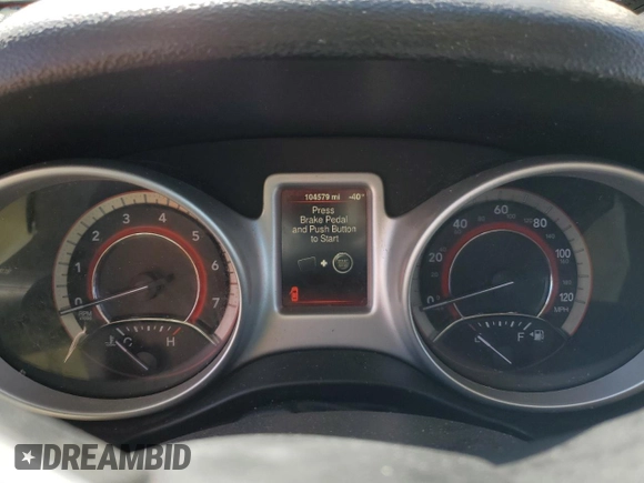 2015 Dodge Journey American Value with VIN 3C4PDCABXFT712192, listed as a Copart auction lot 55680975 with 104,579 mi miles and Salvage Title. Bid and sale history available at DreamBid. Image 9.