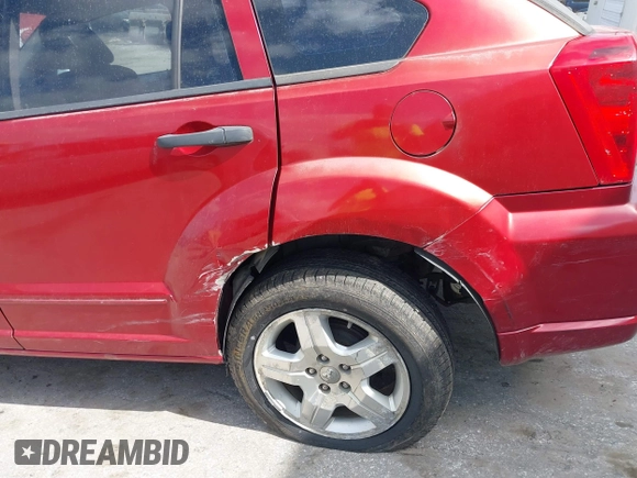 2007 Dodge Caliber SXT with VIN 1B3HB48B07D351411, listed as a IAAI auction lot 41908669 with 152,176 mi miles and . Bid and sale history available at DreamBid. Image 6.