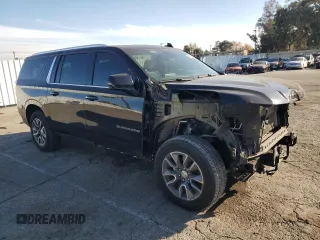 2023 Chevrolet Suburban LT with VIN 1GNSCCKD1PR124986, listed as a Copart auction lot 87432904 with 105,026 mi miles and Salvage Title. Bid and sale history available at DreamBid. Image 4.