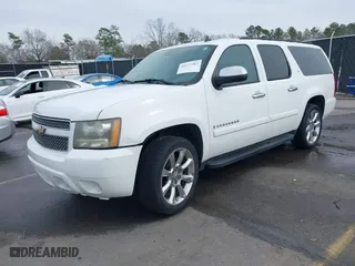 2008 Chevrolet Suburban LTZ with VIN 1GNFC16018R143195, listed as a IAAI auction lot 41577367 with 223,506 mi miles. Bid and sale history available at carsss.com. Image 2.
