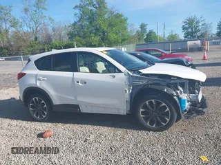 2016 Mazda CX-5 Grand Touring with VIN JM3KE4DY1G0680431, listed as a IAAI auction lot 42136637 with 166,348 mi miles. Bid and sale history available at carsss.com. Image 14.