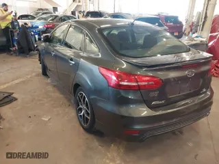 2016 Ford Focus SE with VIN 1FADP3F25GL308870, listed as a IAAI auction lot 41690326 with 103,136 mi miles. Bid and sale history available at carsss.com. Image 3.