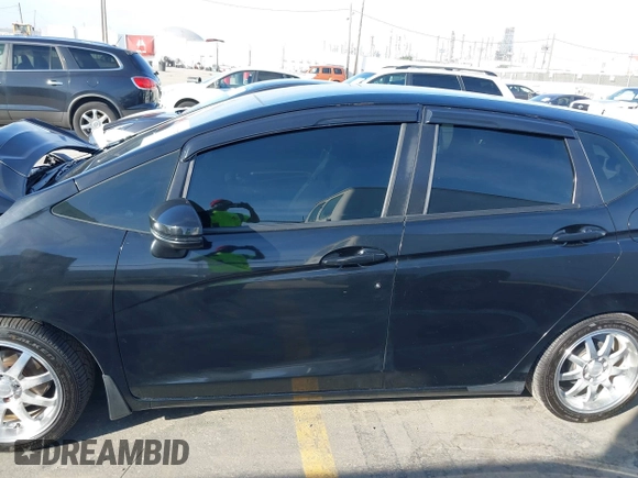 2015 Honda Fit LX z VIN 3HGGK5H57FM717203, wystawiony jako IAAI lot #41615075 z przebiegiem 99 933 mil mil oraz . Historia ofert i sprzedaży dostępna na DreamBid. Obrazek 14.