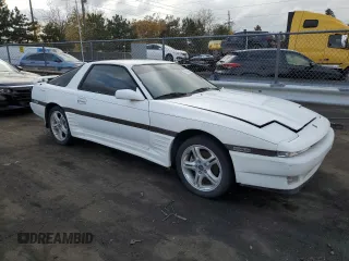 1987 Toyota Supra z VIN JT2MA70L2H0044216, wystawiony jako Copart lot #78864694 z przebiegiem 143 418 mil mil oraz Czysty tytuł • Clean title. Historia ofert i sprzedaży dostępna na DreamBid. Obrazek 4.