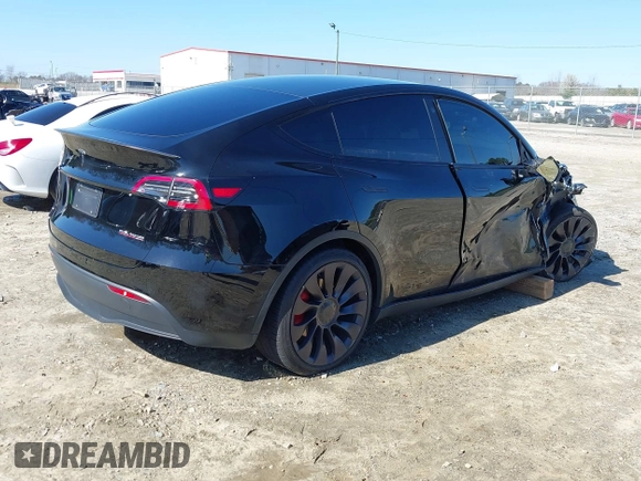2021 Tesla Model Y Performance with VIN 5YJYGDEF6MF252877, listed as a IAAI auction lot 41770770 with 58,550 mi miles and . Bid and sale history available at DreamBid. Image 4.