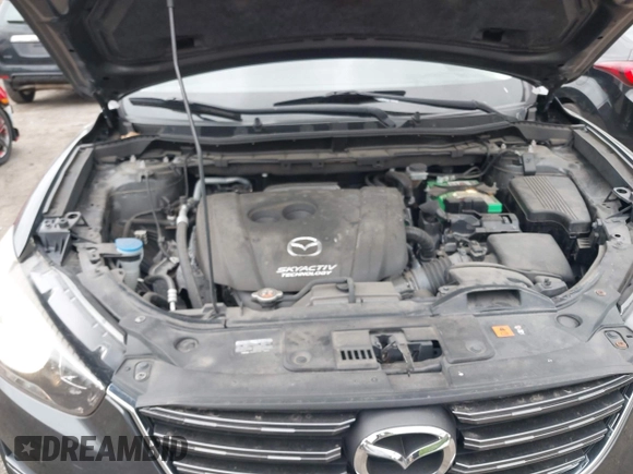 2016 Mazda CX-5 Sport with VIN JM3KE4BY9G0710004, listed as a IAAI auction lot 42323434 with 83,320 mi miles and . Bid and sale history available at DreamBid. Image 10.