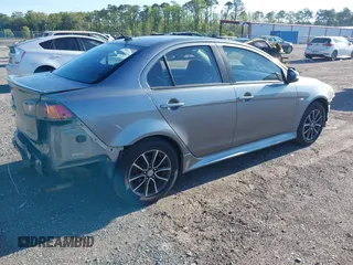 2015 Mitsubishi Lancer SE with VIN JA32V2FWXFU023626, listed as a IAAI auction lot 42012381 with 143,981 mi miles. Bid and sale history available at carsss.com. Image 4.