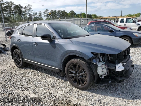 2024 Mazda CX-5 S Carbon Edition z VIN JM3KFBCL5R0493025, wystawiony jako Copart lot #52596785 z przebiegiem 12 360 mil mil oraz Szkoda całkowita • Salvage title. Historia ofert i sprzedaży dostępna na DreamBid. Obrazek 4.