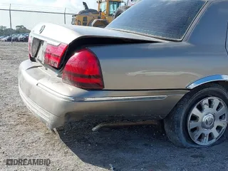 2004 Mercury Grand Marquis LS Premium with VIN 2MEFM75W14X606756, listed as a IAAI auction lot 41572470 with 106,498 mi miles. Bid and sale history available at carsss.com. Image 14.