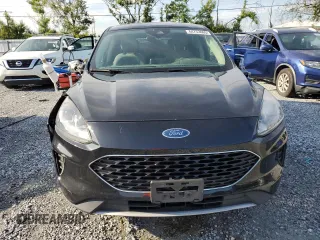 2020 Ford Escape SE z VIN 1FMCU9G60LUB71341, wystawiony jako Copart lot #64753865 z przebiegiem 138 490 mil mil oraz Czysty tytuł • Clean title. Historia ofert i sprzedaży dostępna na DreamBid. Obrazek 5.