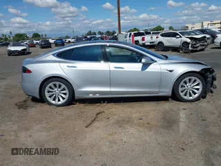 2016 Tesla Model S 90D with VIN 5YJSA1E22GF174637, listed as a IAAI auction lot 42234083 with 142,915 mi miles and . Bid and sale history available at DreamBid. Image 14.