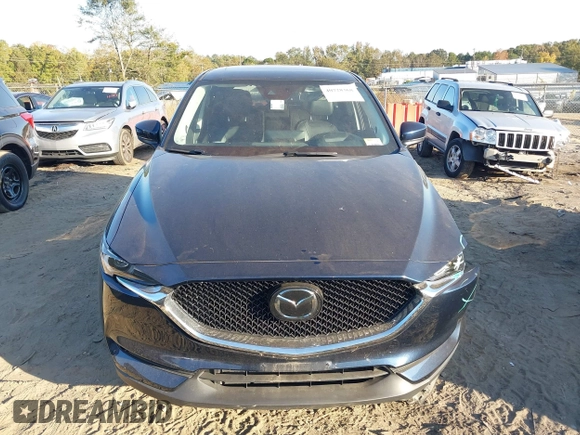 2021 Mazda CX-5 Grand Touring Reserve with VIN JM3KFBAYXM0465762, listed as a IAAI auction lot 40728368 with 30,667 mi miles. Bid and sale history available at carsss.com. Image 12.