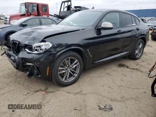 2020 BMW X4 M40i with VIN 5UX2V5C01L9D35126, listed as a Copart auction lot 87261374 with 56,904 mi miles and Clean Title. Bid and sale history available at carsss.com. Image 1.
