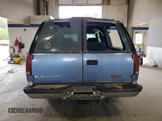 1994 GMC Suburban z VIN 1GKFK16K3RJ725171, wystawiony jako Copart lot #57914635 z przebiegiem 226 183 mil mil oraz Tytuł czysty. Historia ofert i sprzedaży dostępna na DreamBid. Obrazek 6.