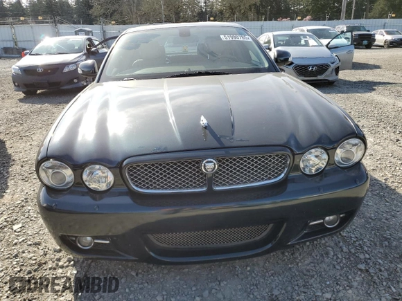 2008 Jaguar XJ with VIN SAJWA79BX8SH23430, listed as a Copart auction lot 51990785 with 140,454 mi miles and Salvage Title. Bid and sale history available at carsss.com. Image 5.