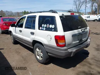 2004 Jeep Grand Cherokee Laredo with VIN 1J4GW48S54C314056, listed as a IAAI auction lot 42096065 with 164,113 mi miles. Bid and sale history available at carsss.com. Image 3.