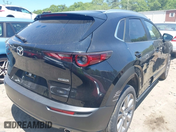 2022 Mazda CX-30 S Carbon Edition with VIN 3MVDMBCL3NM440188, listed as a IAAI auction lot 42259723 with 48,555 mi miles and . Bid and sale history available at DreamBid. Image 4.