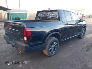 2024 Honda Ridgeline Sport with VIN 5FPYK3F14RB012334, listed as a IAAI auction lot 41542412 with 1,817 mi miles and . Bid and sale history available at DreamBid. Image 4.