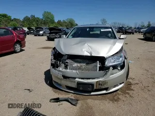 2013 Buick LaCrosse Premium 2 z VIN 1G4GH5E33DF158435, wystawiony jako Copart lot #56209755 z przebiegiem 77 565 mil mil oraz Szkoda całkowita • Salvage title. Historia ofert i sprzedaży dostępna na DreamBid. Obrazek 14.