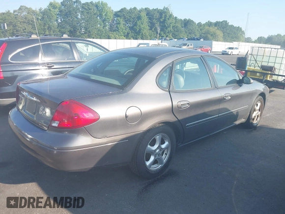 2002 Ford Taurus SES Standard z VIN 1FAFP55U22A172533, wystawiony jako IAAI lot #42680611 z przebiegiem 122 306 mil mil oraz . Historia ofert i sprzedaży dostępna na DreamBid. Obrazek 4.