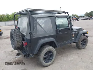 2000 Jeep Wrangler Sahara with VIN 1J4FA59S7YP805628, listed as a IAAI auction lot 42259201 with Not provided miles and . Bid and sale history available at DreamBid. Image 4.