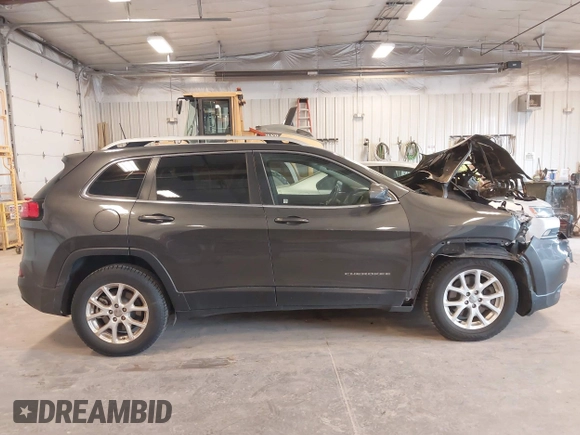 2016 Jeep Cherokee Latitude z VIN 1C4PJMCB3GW187502, wystawiony jako IAAI lot #42048898 z przebiegiem 151 450 mil mil oraz . Historia ofert i sprzedaży dostępna na DreamBid. Obrazek 13.
