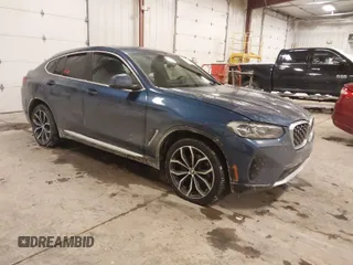 2023 BMW X4 xDrive30i with VIN 5UX33DT01P9R31277, listed as a IAAI auction lot 41618617 with 23,952 mi miles. Bid and sale history available at carsss.com. Image 1.