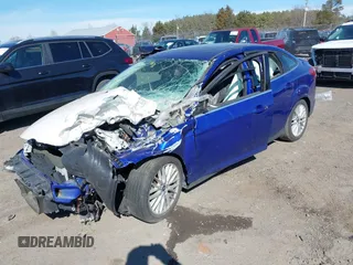2014 Ford Focus Titanium with VIN 1FADP3J21EL427066, listed as a IAAI auction lot 41653163 with 1 mi miles. Bid and sale history available at carsss.com. Image 2.