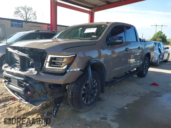 2021 Nissan Titan SV with VIN 1N6AA1ED1MN523973, listed as a IAAI auction lot 42406382 with 73,688 mi miles and . Bid and sale history available at DreamBid. Image 2.