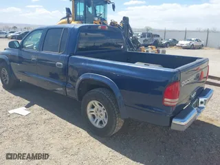 2002 Dodge Dakota SLT with VIN 1B7HL48N32S708719, listed as a IAAI auction lot 42027763 with 217,797 mi miles. Bid and sale history available at carsss.com. Image 3.