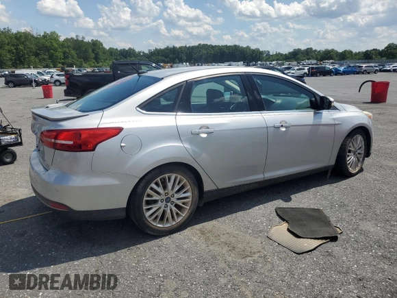 2015 Ford Focus Titanium with VIN 1FADP3J27FL267339, listed as a Copart auction lot 63395835 with 73,372 mi miles and Salvage title. Bid and sale history available at DreamBid. Image 3.
