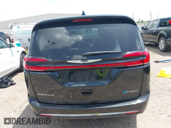 2023 Chrysler Pacifica Hybrid Touring L with VIN 2C4RC1L70PR622000, listed as a IAAI auction lot 42711826 with 65,109 mi miles and . Bid and sale history available at DreamBid. Image 17.